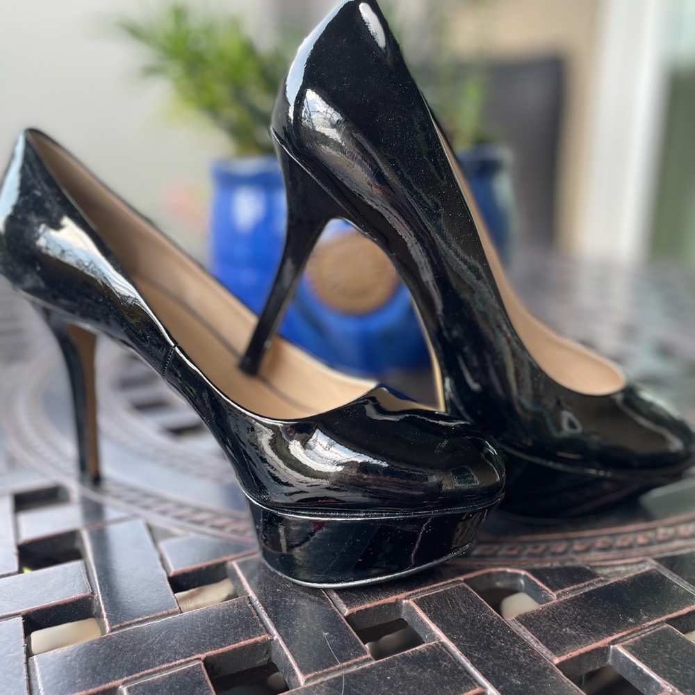 Black patent leather, NineWest dress shoes. 4” heels size 7.5